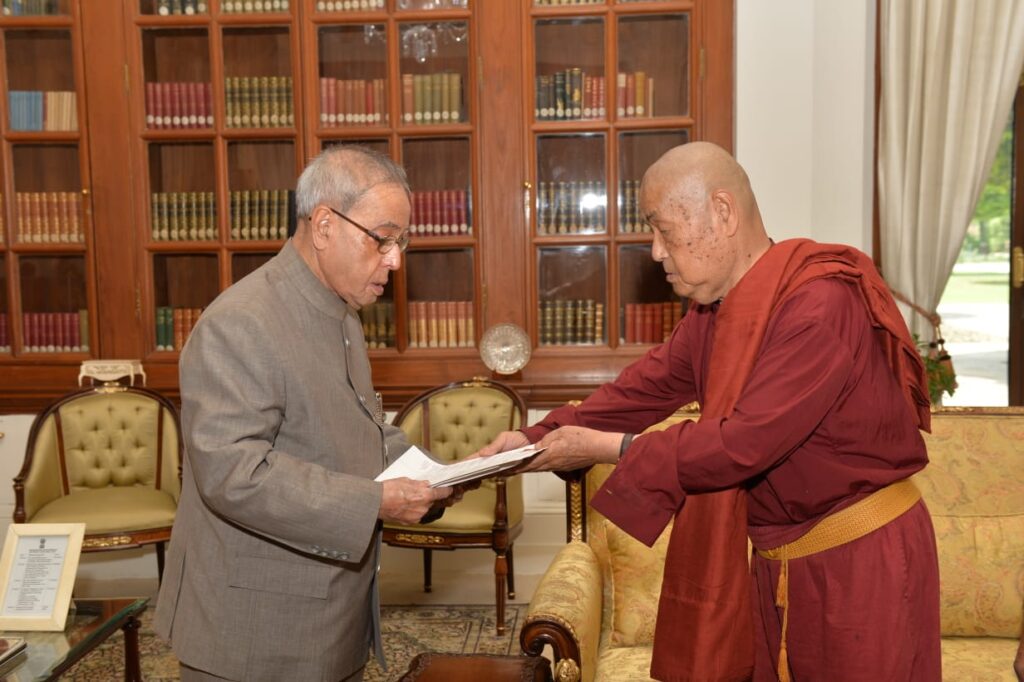 Man in the Blue Suit, Sitting Beside the Buddha!